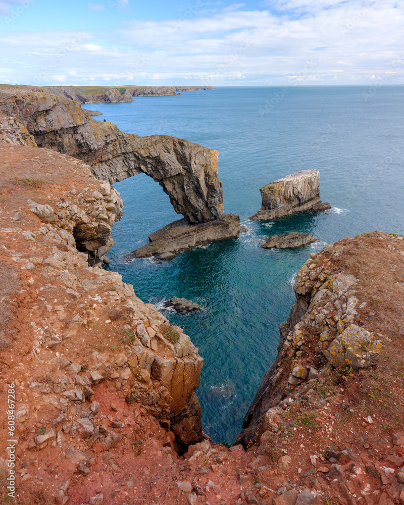 Pembroke, UK - September 24, 2022: The Green Bridge of Wales natural sea arch at Manorbier Pembroke, UK - September 24, 2022: The Green Bridge of Wales natural sea arch at Manorbier