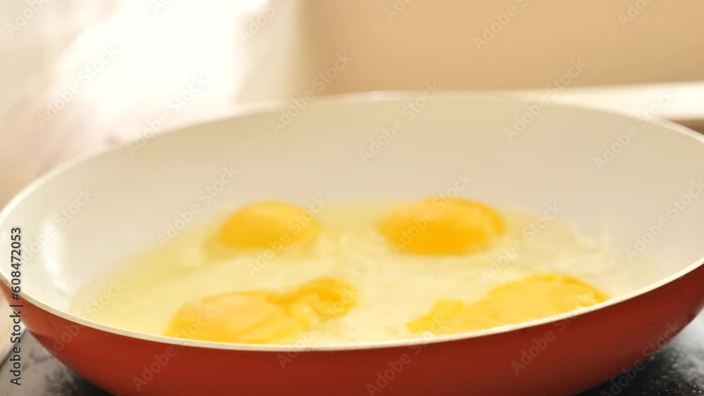 Fried eggs for breakfast. protein breakfast. Appetizing fried eggs in sunflower oil.Eggs fall into the frying pan and fry with smoke. process of preparing breakfast. scrambled eggs. 4k footage Fried eggs for breakfast. protein breakfast. Appetizing fried eggs in sunflower oil.Eggs fall into the frying pan and fry with smoke. process of preparing breakfast. scrambled eggs. 4k footage