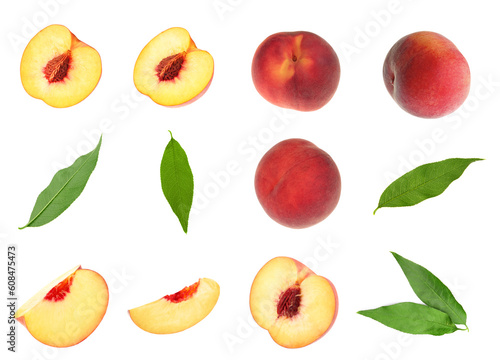 Fresh peaches and green leaves on white background