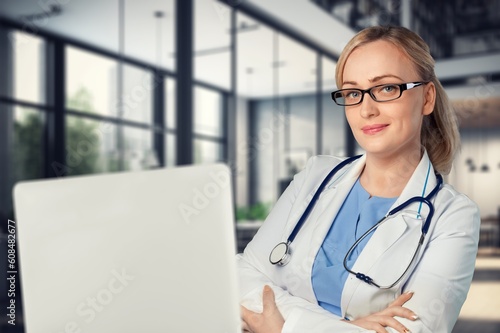 Young female doctor work on laptop computer