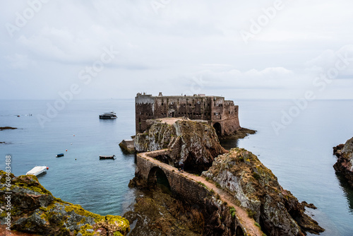 São João Batista fort of the Berlenga Islands of Portugal. Boats in the horizon landscape. Castle in the middle of the water in the Iberian Peninsula.