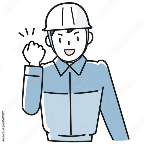 ガッツポーズをする作業服を着た若い男性