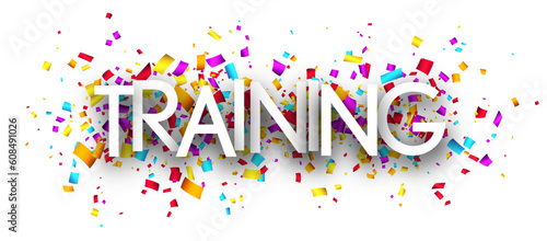 Training sign over colorful cut ribbon confetti background.