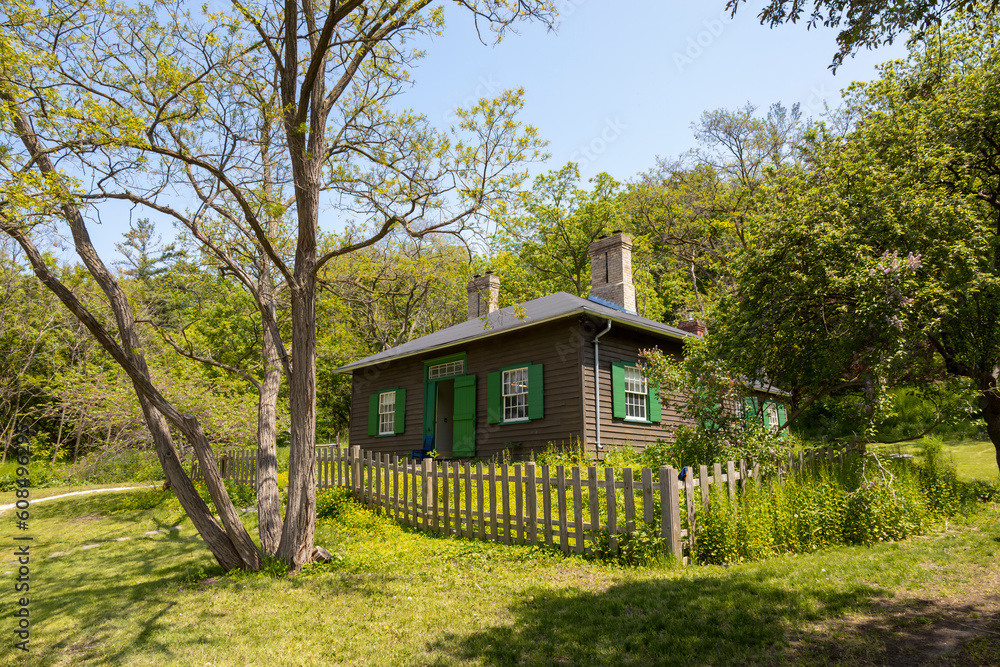 An old house is surrounded by a picket fence at the historic site of Todmorden Mills in Toronto, Ontario. An old house is surrounded by a picket fence at the historic site of Todmorden Mills in Toronto, Ontario.