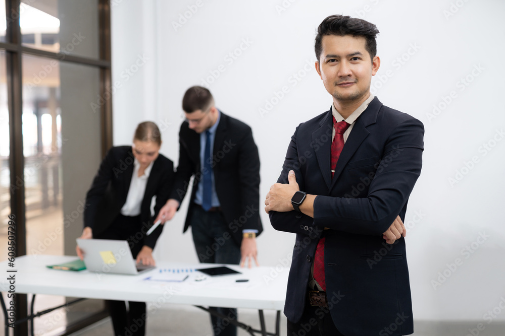 Portrait of Asian business people of male mature asian ceo businessman leader with diverse coworkers team. Portrait of Asian business people of male mature asian ceo businessman leader with diverse coworkers team.