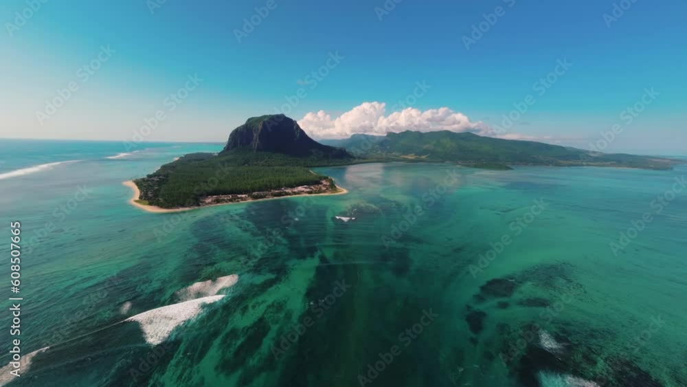 flying high towards le morne underwater waterfall in mauritius bright sunny day drone aerial 4k