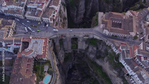 Topdown shot of famous unesco heritage town Ronda and Puente Nuevo Bridge at sunrise, Aerial 4k