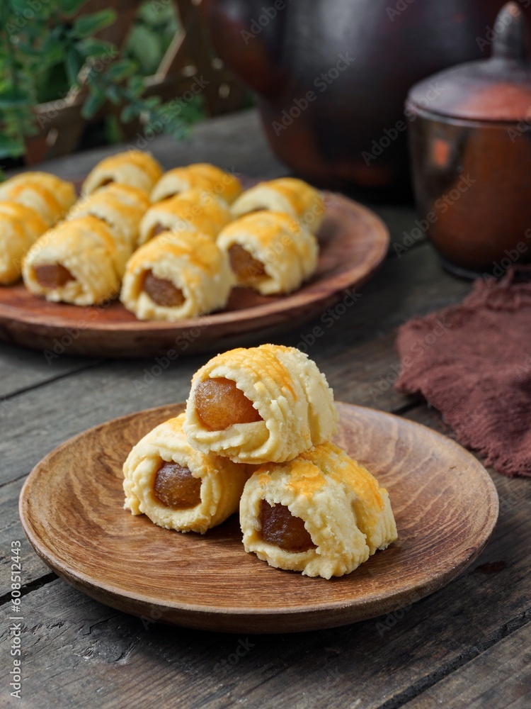 Pineapple Tart Roll cookies or Malay named Tart Nanas Gulung on dark background Pineapple Tart Roll cookies or Malay named Tart Nanas Gulung on dark background