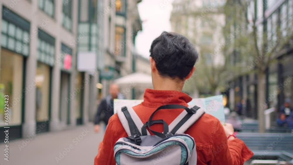Asian young man backpacker traveler looking at map to find destination. Asian young man backpacker traveler looking at map to find destination.