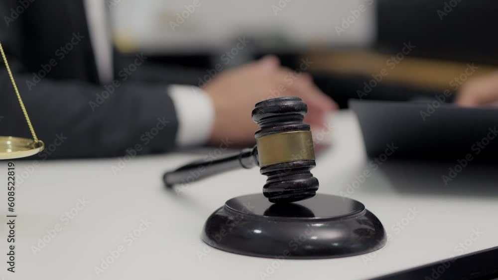 Consult Judge or lawyer Hand Writing Document in Court Room. Consult Judge or lawyer Hand Writing Document in Court Room.