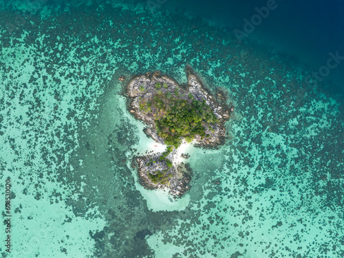 Bird 's eye view of summer tropical islands in the ocean -coral reef as white sand beach and turquoise water background.