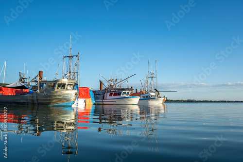 fishing boats docked in the wharf harbor