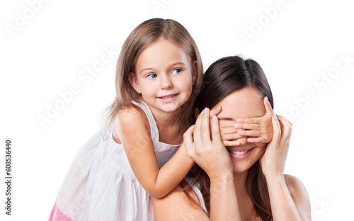 Happy young daughter closes hands eyes mom