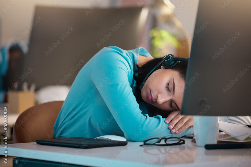 Call center, customer service and a woman consultant sleeping at her desk in the office late at night. Exhausted, overworked and a tired female employee asleep while consulting for crm or sales Call center, customer service and a woman consultant sleeping at her desk in the office late at night. Exhausted, overworked and a tired female employee asleep while consulting for crm or sales