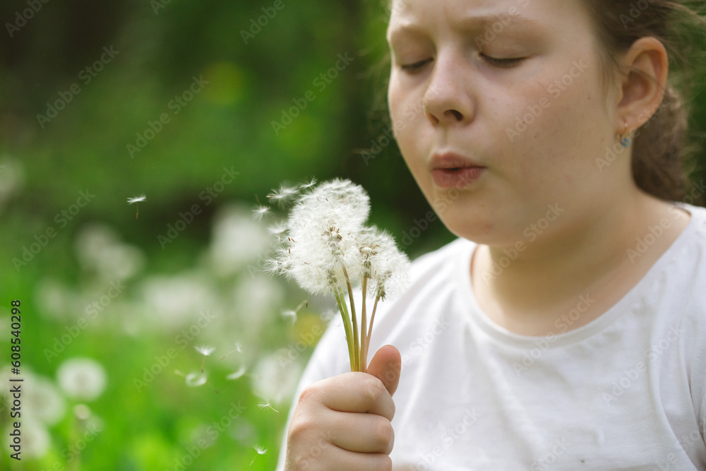 Summer joy - lovely girl blowing dandelion Summer joy - lovely girl blowing dandelion