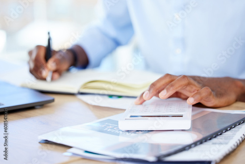 Business, closeup and black man with a calculator, writing and notebook with planning, finance and budget. Male person, accountant and employee with documents, paperwork and folders with numbers