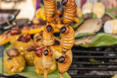 The larva of Rhynchophorus palmarum better known as Suri in the Amazon jungle of Peru, is a rich and nutritious and very exotic food photo
