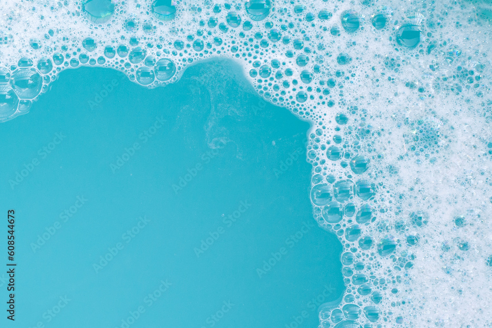 Detergent foam bubble on wate. Blue background, Soap sud - obrazy, fototapety, plakaty 