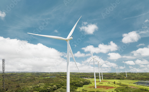 Wind turbine green energy generator in the blue sky