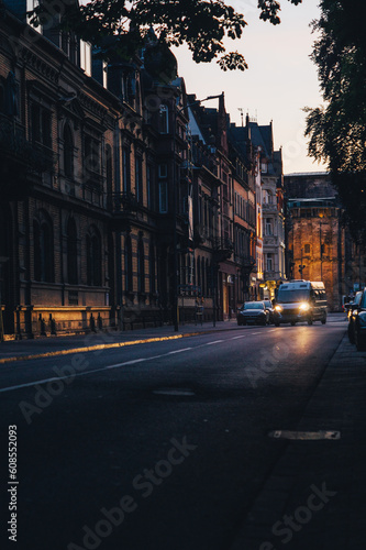 Trier during sunset. Early evening. Lone van driving through a main street in the city. © steve