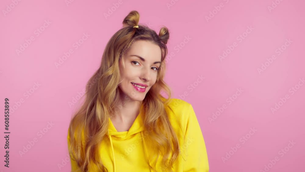 Excited young woman dancing having fun rhythm to music, enjoying life, entertainment. Carefree smiling emotional female lady dance waving hands. Lifestyle, indoor studio isolated on pink background. Excited young woman dancing having fun rhythm to music, enjoying life, entertainment. Carefree smiling emotional female lady dance waving hands. Lifestyle, indoor studio isolated on pink background.