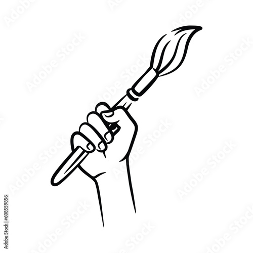 A fist hand holding a decorators paintbrush