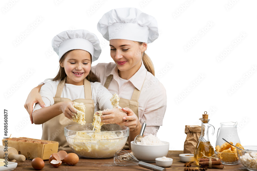 The beautiful young mother and her little daughter cook at home The beautiful young mother and her little daughter cook at home
