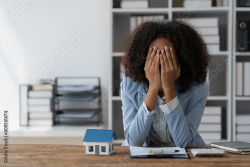 agent, american businesswoman Africans are working hard, stressed, and having a headache with the leasing contract paperwork. Financial agreements, loans, mortgages, rentals, insurance, real estate