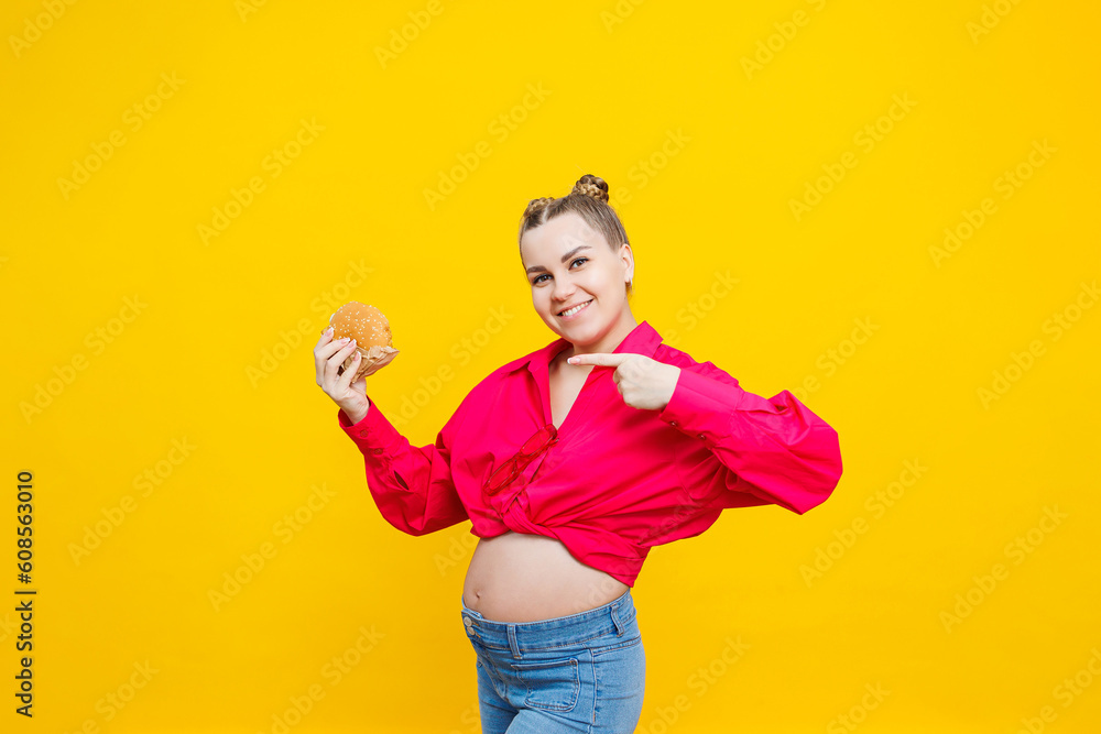 Funny Pregnant Young Woman Eating Burger Pregnant Woman Holding Tasty funny-pregnant-young-woman-eating-burger-pregnant-woman-holding-tasty