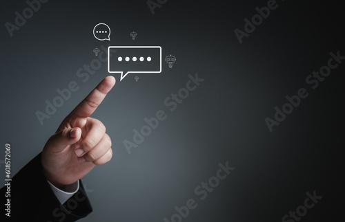 Businessman hand pointing at chat icon on digital web communication application and social network concept. social media application chat box