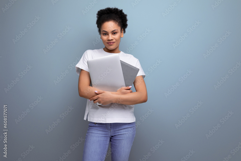 young successful hispanic brunette woman student studying to be a programmer. laptop in the frame
