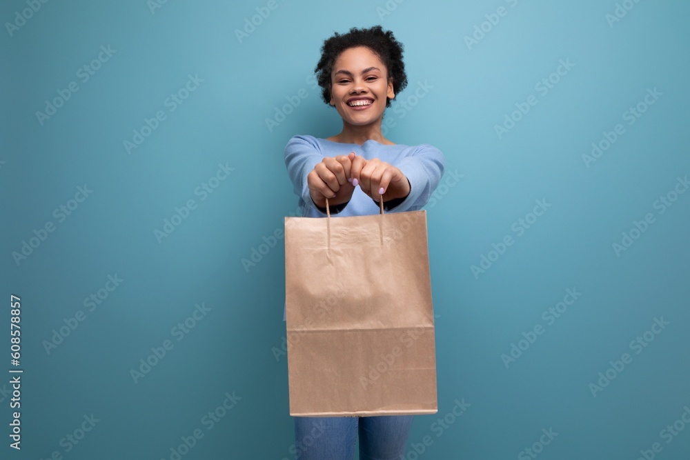 positive brunette afro hair woman holding recyclable craft bag positive brunette afro hair woman holding recyclable craft bag