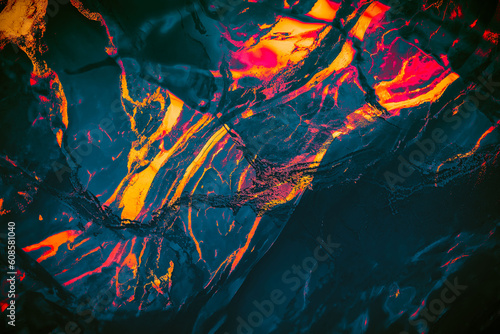 Abstract mass of charcoal blue color with fiery viens	
 photo