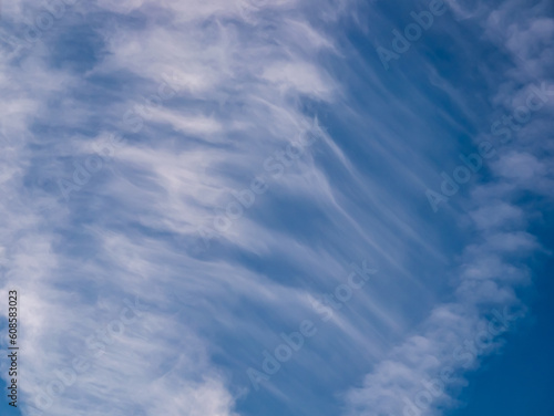 Clouds - cirrus cloud - in the shape of a waterfall in the blue sky