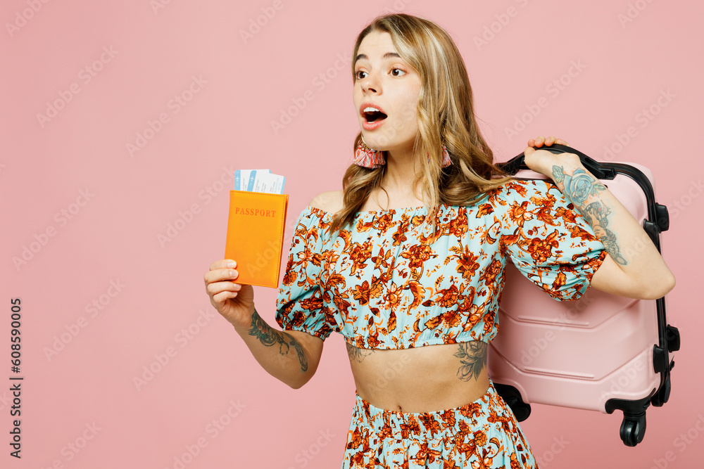 Traveler sad woman wear summer casual clothes hold passport boarding ticket bag isolated on plain pink background Tourist travel abroad in free spare time rest getaway Air flight trip journey concept Traveler sad woman wear summer casual clothes hold passport boarding ticket bag isolated on plain pink background Tourist travel abroad in free spare time rest getaway Air flight trip journey concept