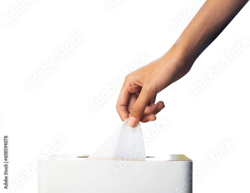 Foto hand pulling tissue sheet from storage box
