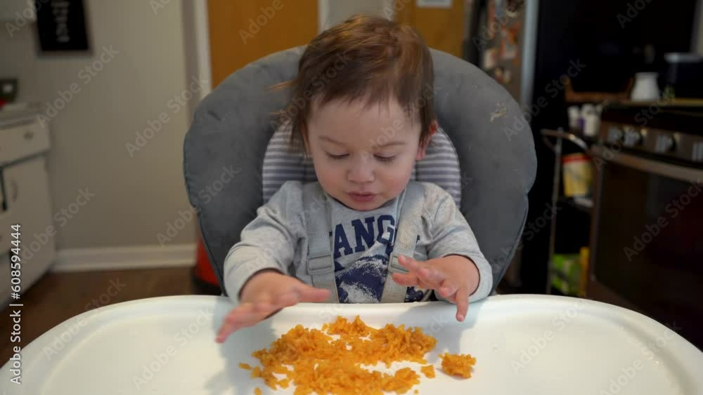 biracial hispanic latino white caucasian baby eating rice in a high chair 4k biracial hispanic latino white caucasian baby eating rice in a high chair 4k