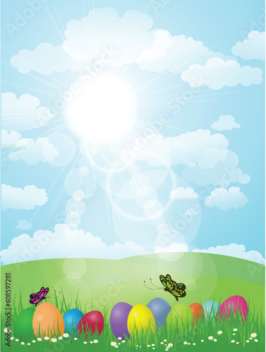 Easter eggs in grass with butterflies and a sunny landscape