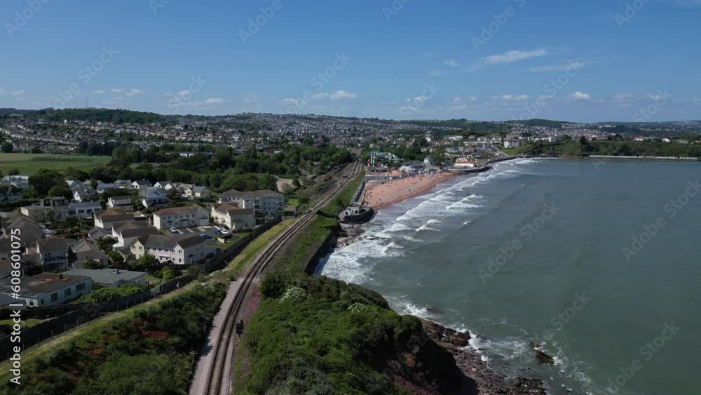 Goodrington Sands, Paignton, Torbay, Devon, England: DRONE VIEWS: Goodrington Sands on a bright sunny, summer day showing holidaymakers / tourists sunbathing on the beach and swimming in the sea. Goodrington Sands, Paignton, Torbay, Devon, England: DRONE VIEWS: Goodrington Sands on a bright sunny, summer day showing holidaymakers / tourists sunbathing on the beach and swimming in the sea.