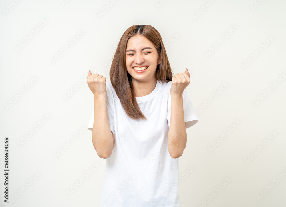 Beautiful young asian woman age around 25 smiling. Charming female standing on isolated background. People pose Excited shocked face asian woman shout out loud wow Joyful winning victory challenge Beautiful young asian woman age around 25 smiling. Charming female standing on isolated background. People pose Excited shocked face asian woman shout out loud wow Joyful winning victory challenge