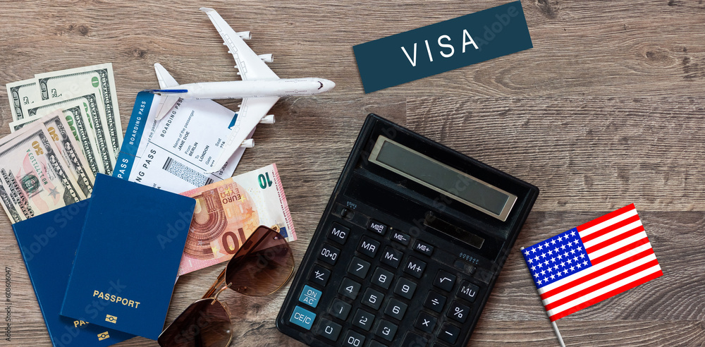 Φωτογραφία Flag of United States with passport and toy airplane on wooden background