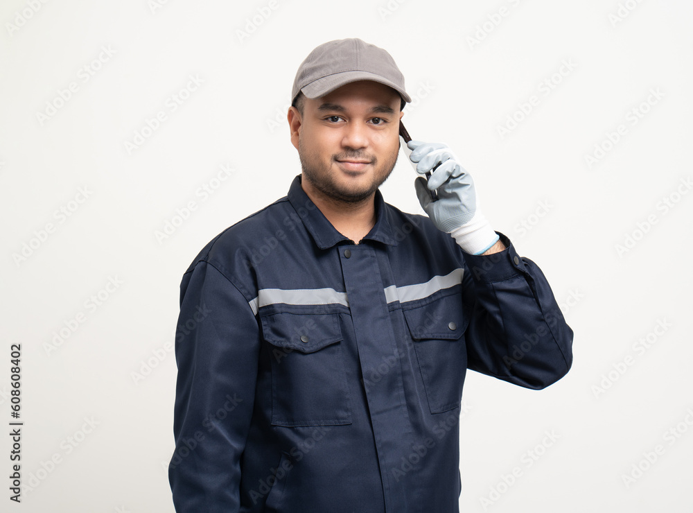 Technician workers in uniform maintenance service with smartphone. Profession of service industry house repair. Home services with cellphone isolated background. Technician workers in uniform maintenance service with smartphone. Profession of service industry house repair. Home services with cellphone isolated background.