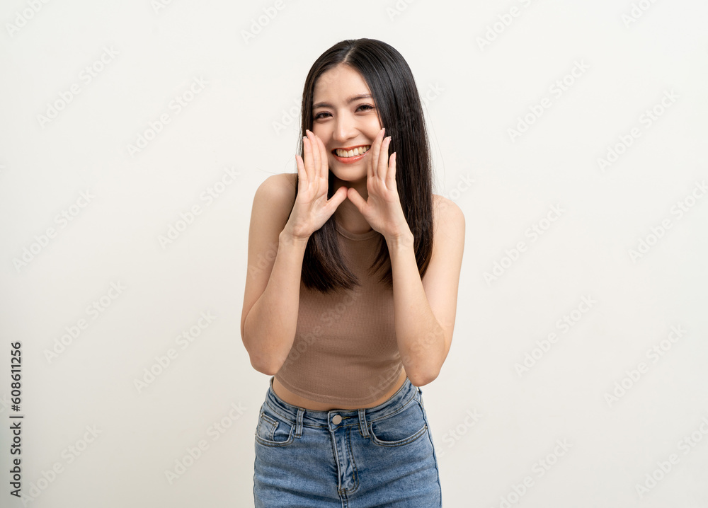 Happy beautiful asian woman with copy space. Excited pretty girl shout out loud wow with hands on mouth announcement standing pose on isolated white background. Happy beautiful asian woman with copy space. Excited pretty girl shout out loud wow with hands on mouth announcement standing pose on isolated white background.