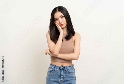 Upset confused bad emotional asian woman. Unhappy stressed female. Young lady standing feeling depressed dramatic scene on isolated background.