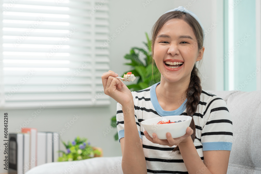 healthy food. Beautiful female girl enjoy eat yogurt, granola, fresh fruits on breakfast health in house. Happy young woman smile on morning good emotion. dieting, detox, diet, clean eat, vegetarian healthy food. Beautiful female girl enjoy eat yogurt, granola, fresh fruits on breakfast health in house. Happy young woman smile on morning good emotion. dieting, detox, diet, clean eat, vegetarian