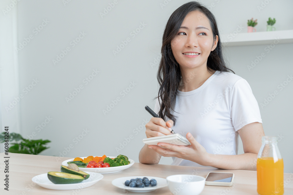 Beauty slim female body choose healthy foods. Woman take note diet progress, healthy life, low calorie, thin waist, nutritionist. Dieting, body shape, balance control, avoid, nutritional Beauty slim female body choose healthy foods. Woman take note diet progress, healthy life, low calorie, thin waist, nutritionist. Dieting, body shape, balance control, avoid, nutritional