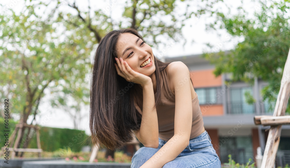 Happy feeling of Beautiful Young Woman smiling outdoor in sunlight. Pretty attractive face of female and beautiful smile. She is positive thinking and successful. Happy feeling of Beautiful Young Woman smiling outdoor in sunlight. Pretty attractive face of female and beautiful smile. She is positive thinking and successful.