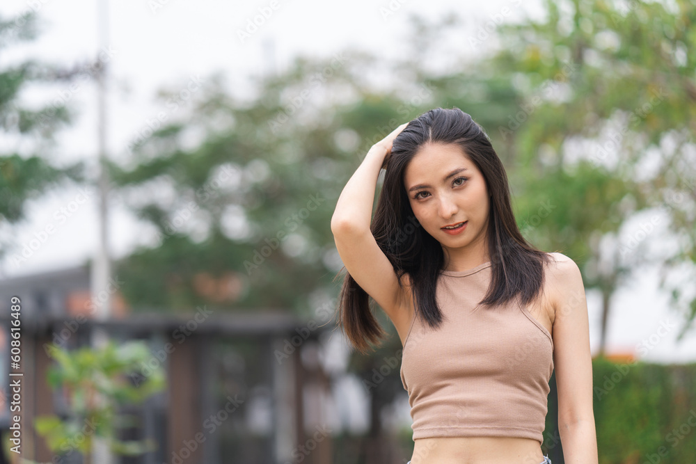 Happy feeling of Beautiful Young Woman smiling outdoor in sunlight. Pretty attractive face of female and beautiful smile. She is positive thinking and successful. Happy feeling of Beautiful Young Woman smiling outdoor in sunlight. Pretty attractive face of female and beautiful smile. She is positive thinking and successful.
