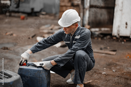 Industrial waste inspector examines the correct storage of hazardous chemicals, radioactive materials, toxic substances. Record field conditions on paperwork, collect data, and report to supervisor.