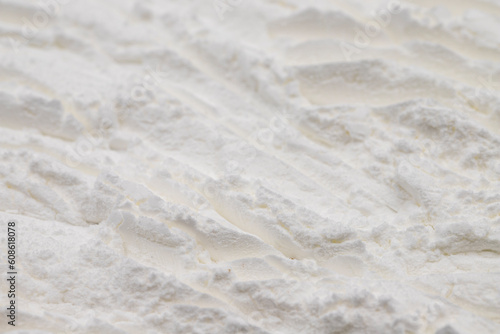 Pile of icing sugar as background. Close-up of powdered sugar